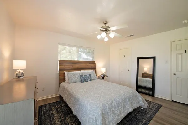 a bedroom with a bed and window