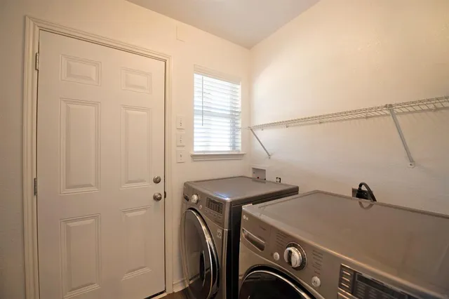 a bedroom with bed and window