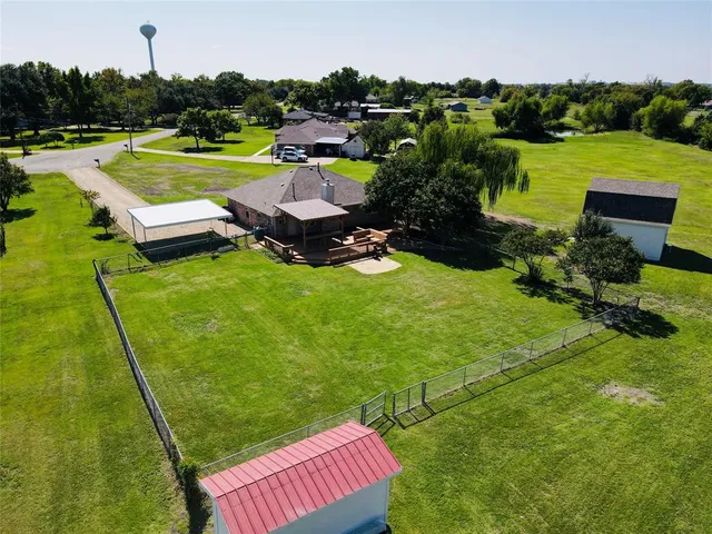 an aerial view of a golf course with chairs