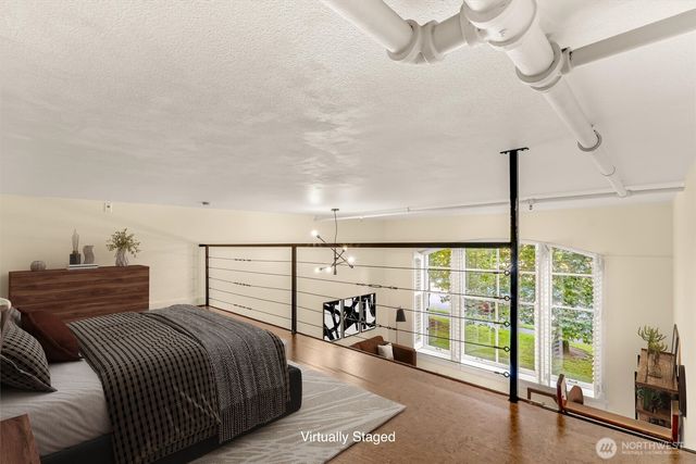 a spacious bedroom with a bed and a table