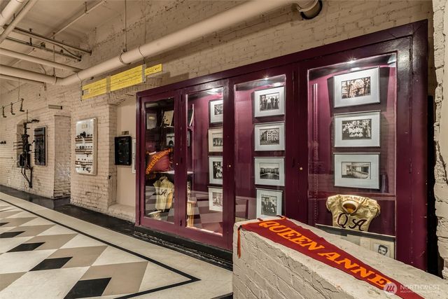 a room with lots of books and furniture
