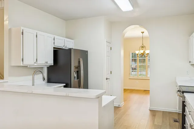 a kitchen with stainless steel appliances a refrigerator and a sink