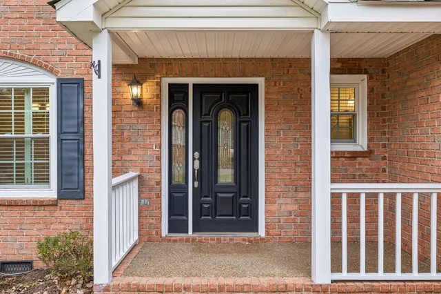 a view of a brick house with front door