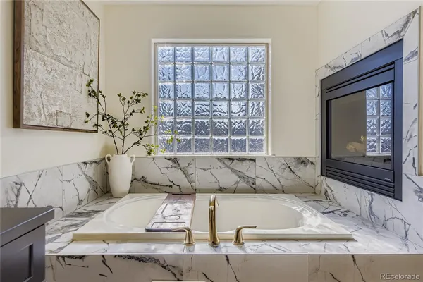 a view of bath tub sitting next to a window