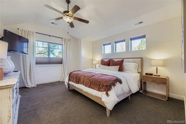 a bedroom with a bed closet and a window