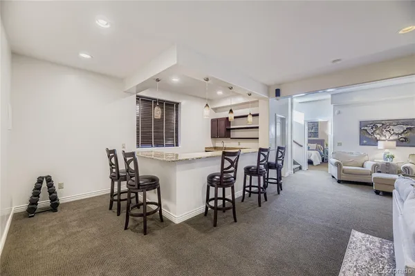 a living room with furniture and a table