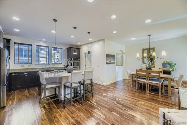 a view of a dining room with furniture and wooden floor