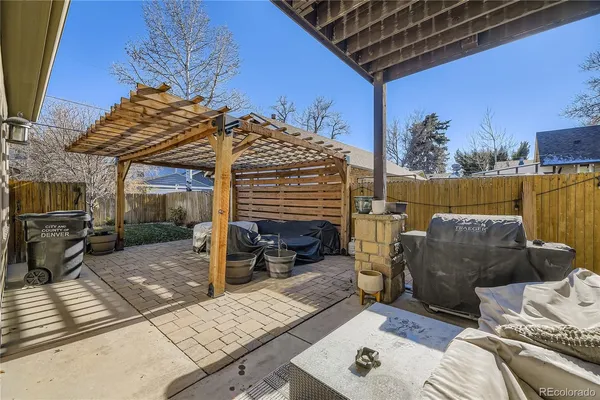 a view of a house with a wooden fence