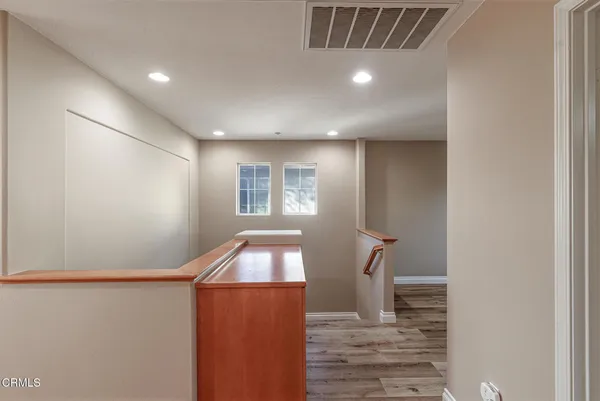 a view of a hallway with windows