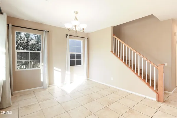 a view of an entryway with wooden floor and windows