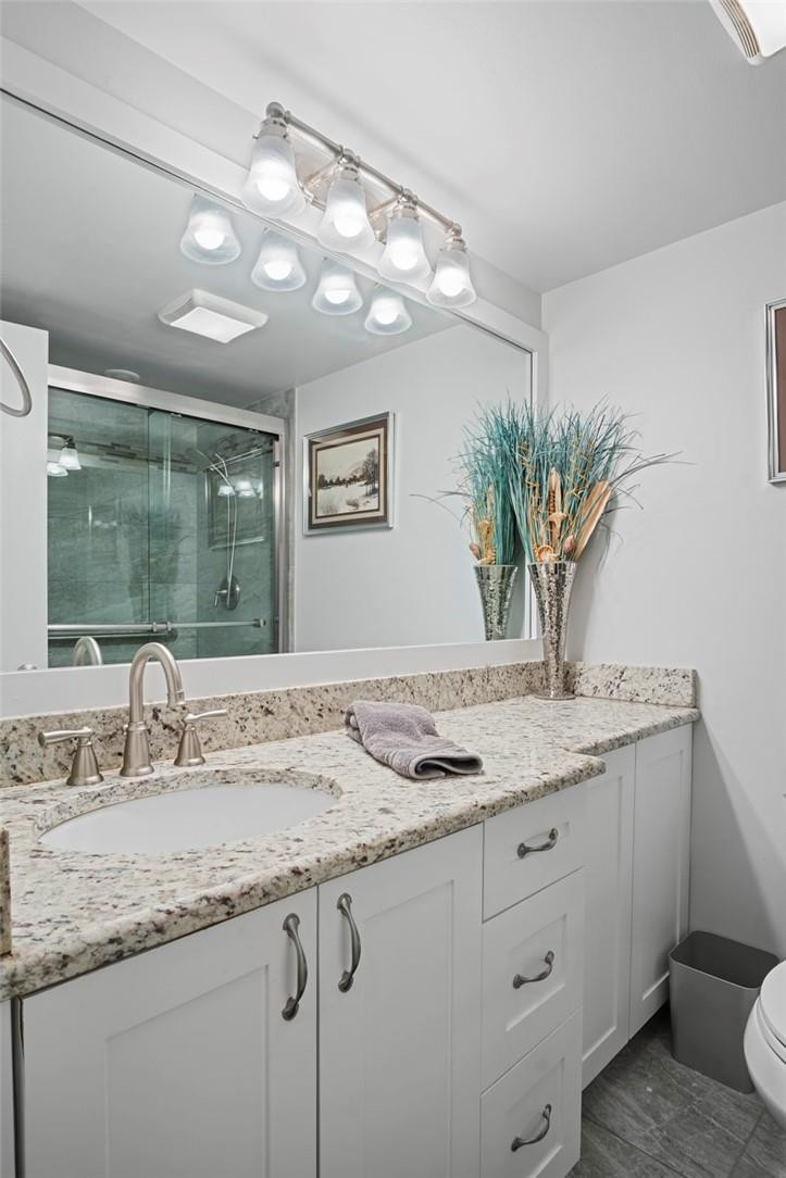 2810 North 46th Avenue, Unit 462 Hollywood, FL 33021 - Photo 12 of 31 a bathroom with a granite countertop sink a mirror and a potted plant