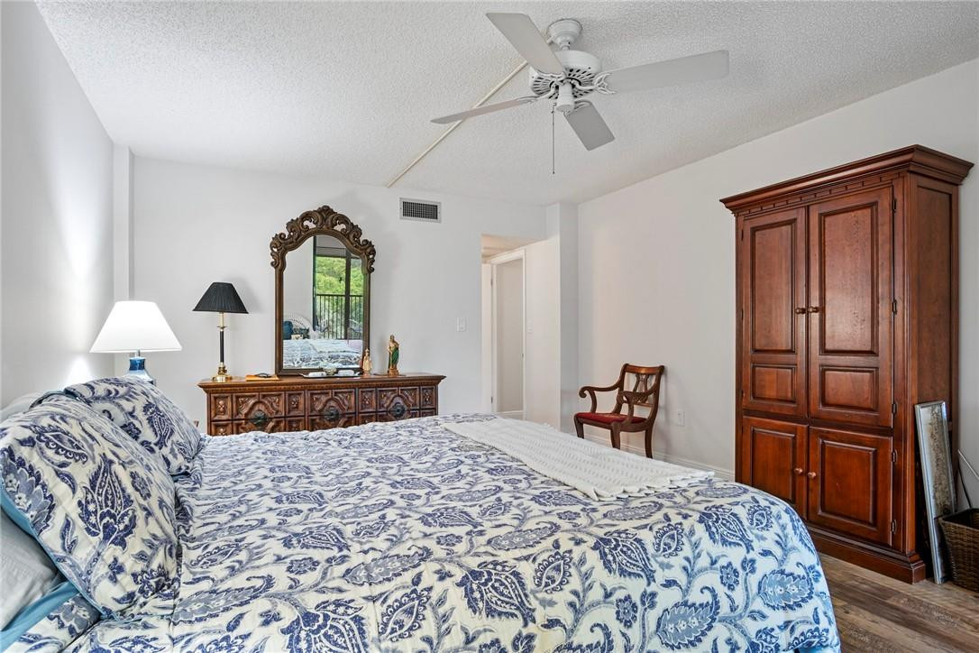 2810 North 46th Avenue, Unit 462 Hollywood, FL 33021 - Photo 15 of 31 a bedroom with a bed and a dresser
