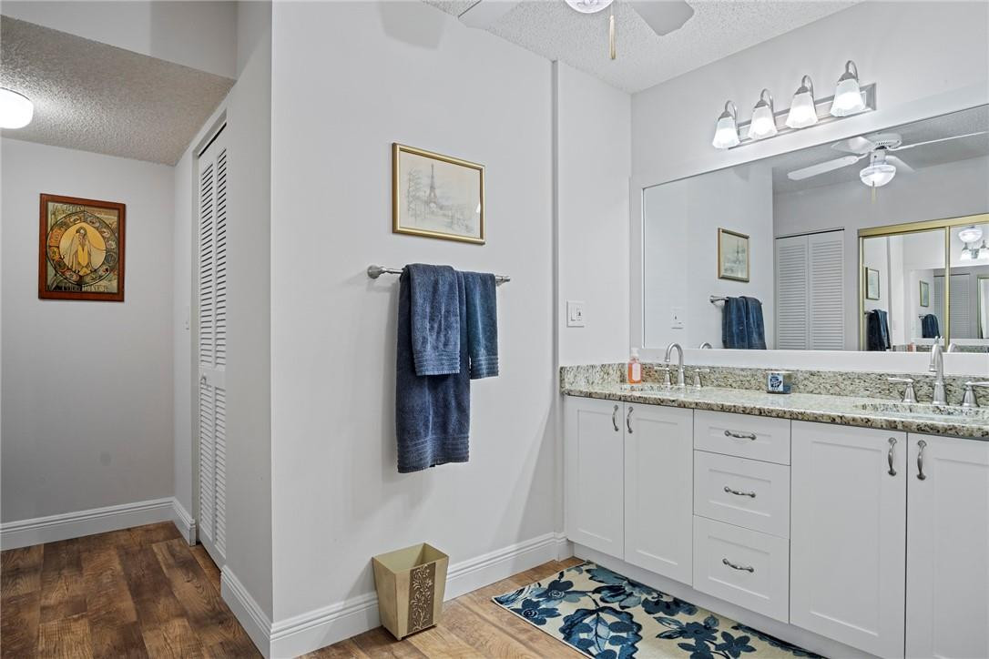 2810 North 46th Avenue, Unit 462 Hollywood, FL 33021 - Photo 16 of 31 a bathroom with a sink and a mirror