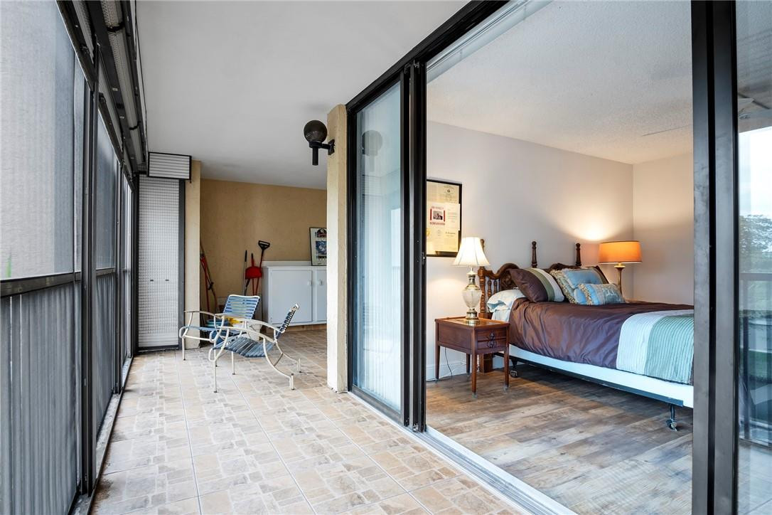 2810 North 46th Avenue, Unit 462 Hollywood, FL 33021 - Photo 17 of 31 a view of living room filled with furniture and a bedroom