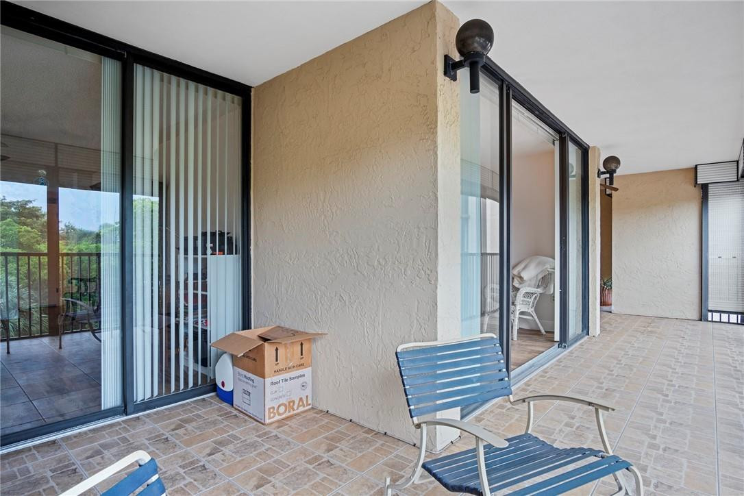 2810 North 46th Avenue, Unit 462 Hollywood, FL 33021 - Photo 18 of 31 a view of a hallway with furniture and windows