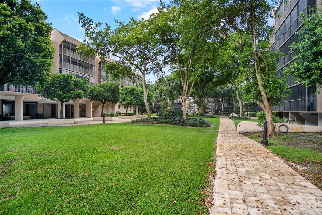 2810 North 46th Avenue, Unit 462 Hollywood, FL 33021 - Photo 22 of 31 a view of a yard with plants and trees