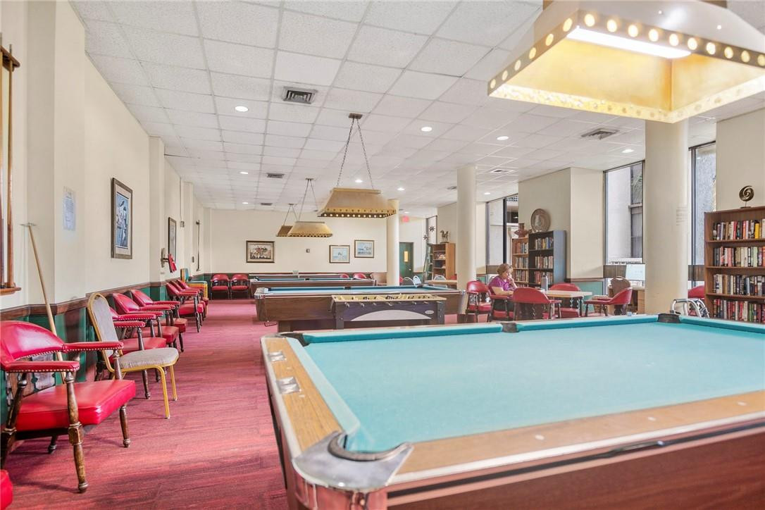 2810 North 46th Avenue, Unit 462 Hollywood, FL 33021 - Photo 23 of 31 a room with lots of chairs and a chandelier