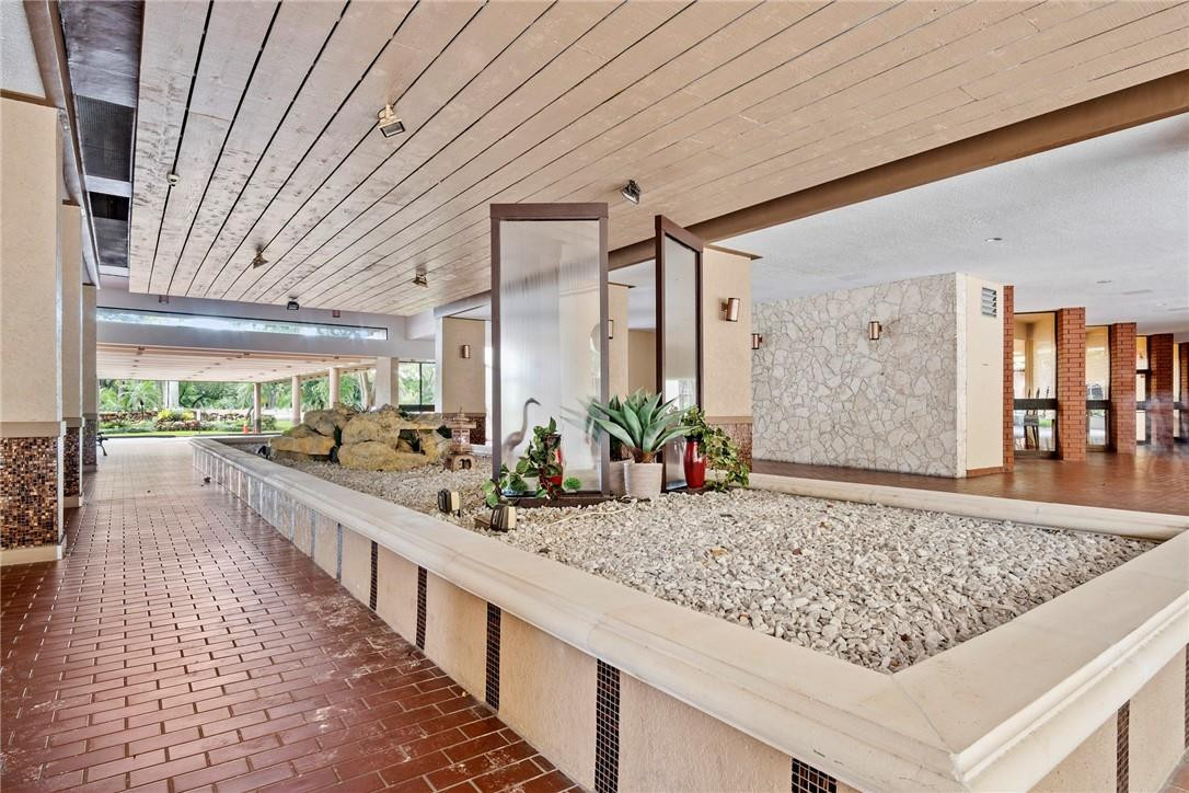 2810 North 46th Avenue, Unit 462 Hollywood, FL 33021 - Photo 27 of 31 a view of a living room and kitchen