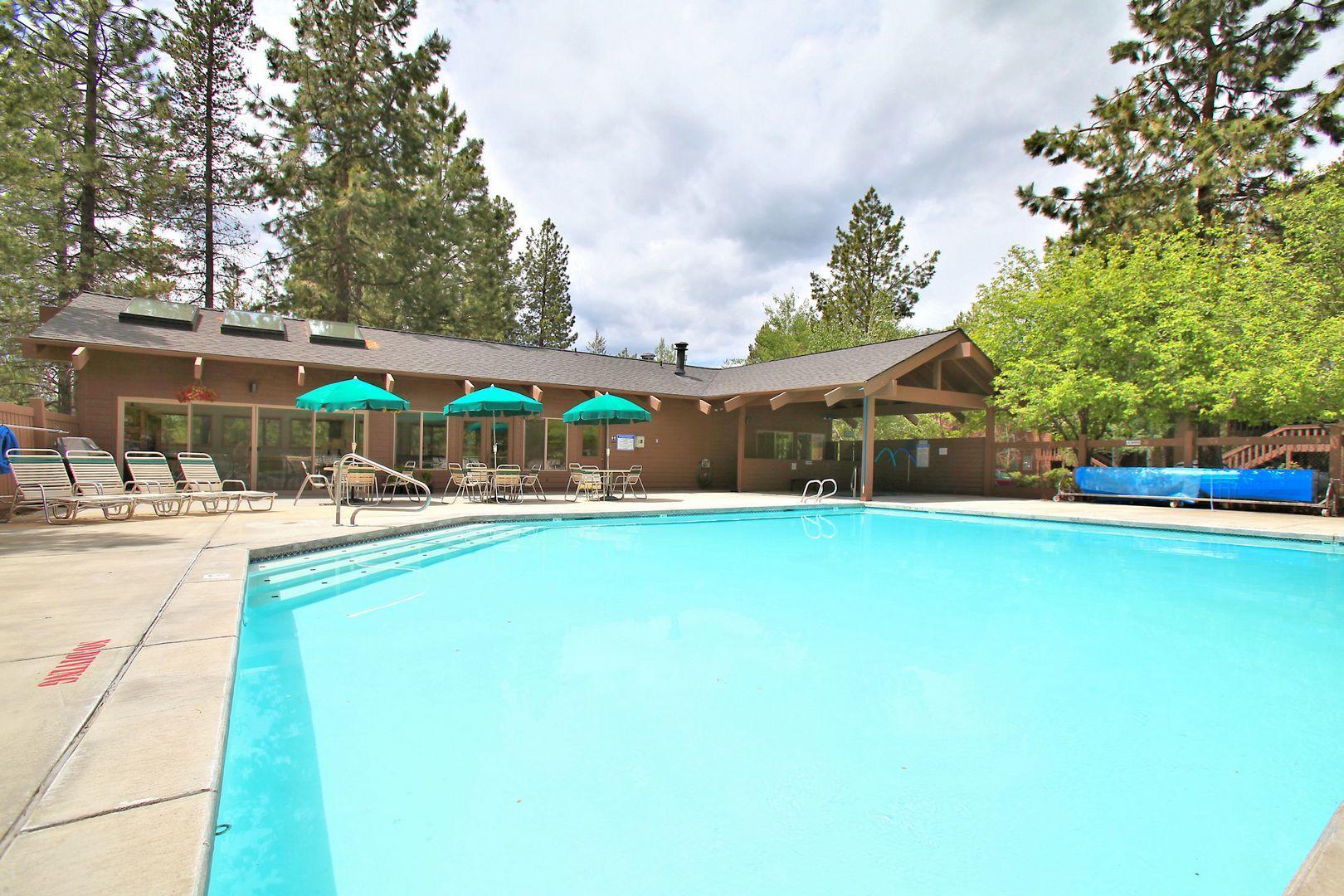 57301 Beaver Ridge Loop, Unit 10 Sunriver, OR 97707 - Photo 20 of 23 a swimming pool with outdoor seating and yard