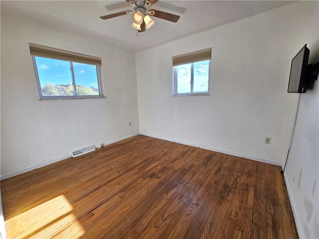 263 Lacock Street Washington, PA 15301 - Photo 12 of 33 a view of empty room with wooden floor and fan