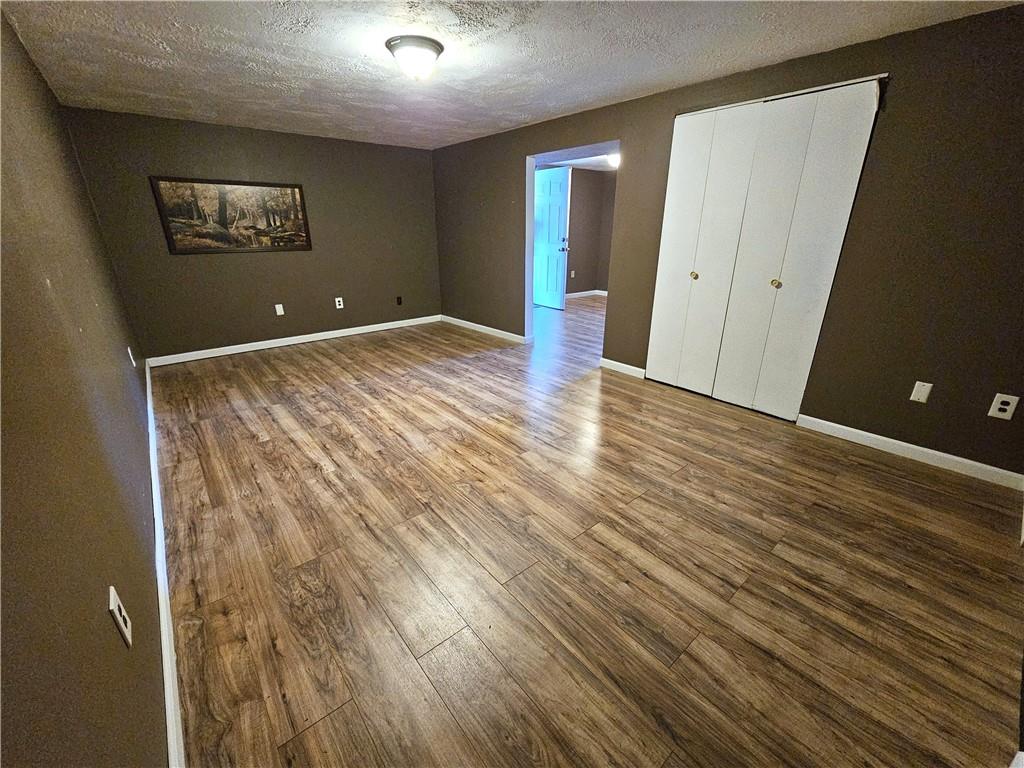 263 Lacock Street Washington, PA 15301 - Photo 19 of 33 an empty room with wooden floor and windows