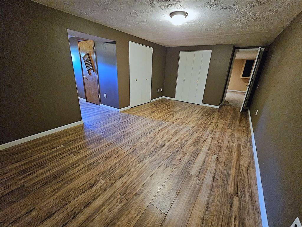 263 Lacock Street Washington, PA 15301 - Photo 20 of 33 a view of an empty room with wooden floor