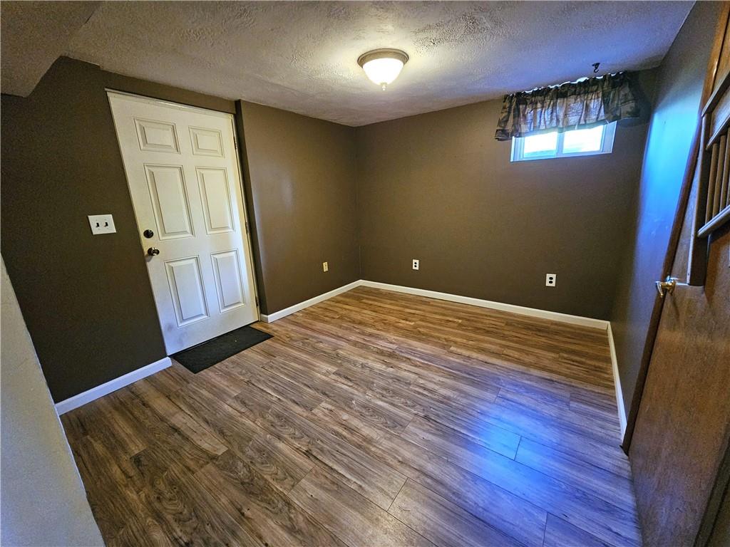 263 Lacock Street Washington, PA 15301 - Photo 21 of 33 a view of an empty room with wooden floor and a window