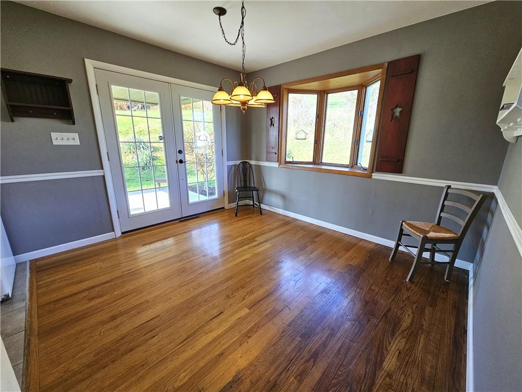 263 Lacock Street Washington, PA 15301 - Photo 8 of 33 a view of an empty room with wooden floor and a window