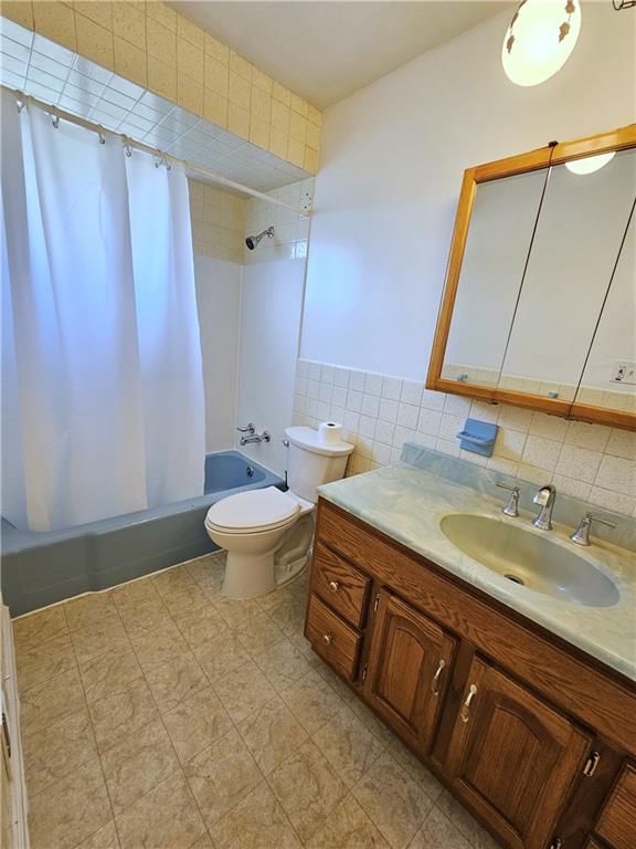 263 Lacock Street Washington, PA 15301 - Photo 10 of 33 a bathroom with a granite countertop sink a toilet and a mirror