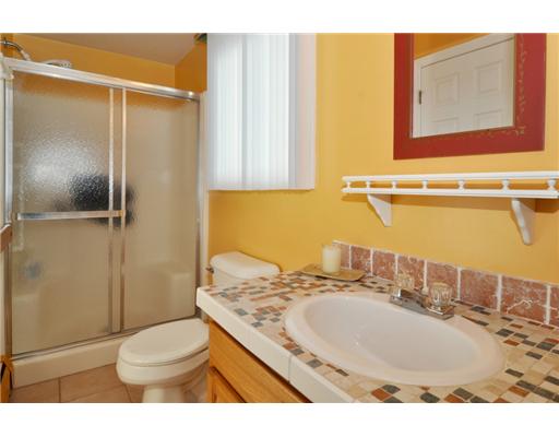 5 White Cap Road Narragansett, RI 02882 - Photo 12 of 20 Bathroom. One of the 3 full bathrooms. This one connects 2nd floor bedroom and kitchen with a pullman style bathroom.