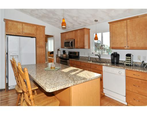5 White Cap Road Narragansett, RI 02882 - Photo 4 of 20 Kitchen. New Maple and granite kitchen, fully applianced