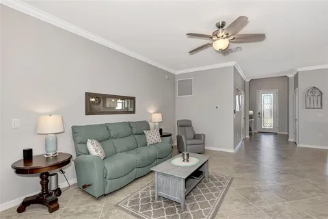 a living room with furniture and a table