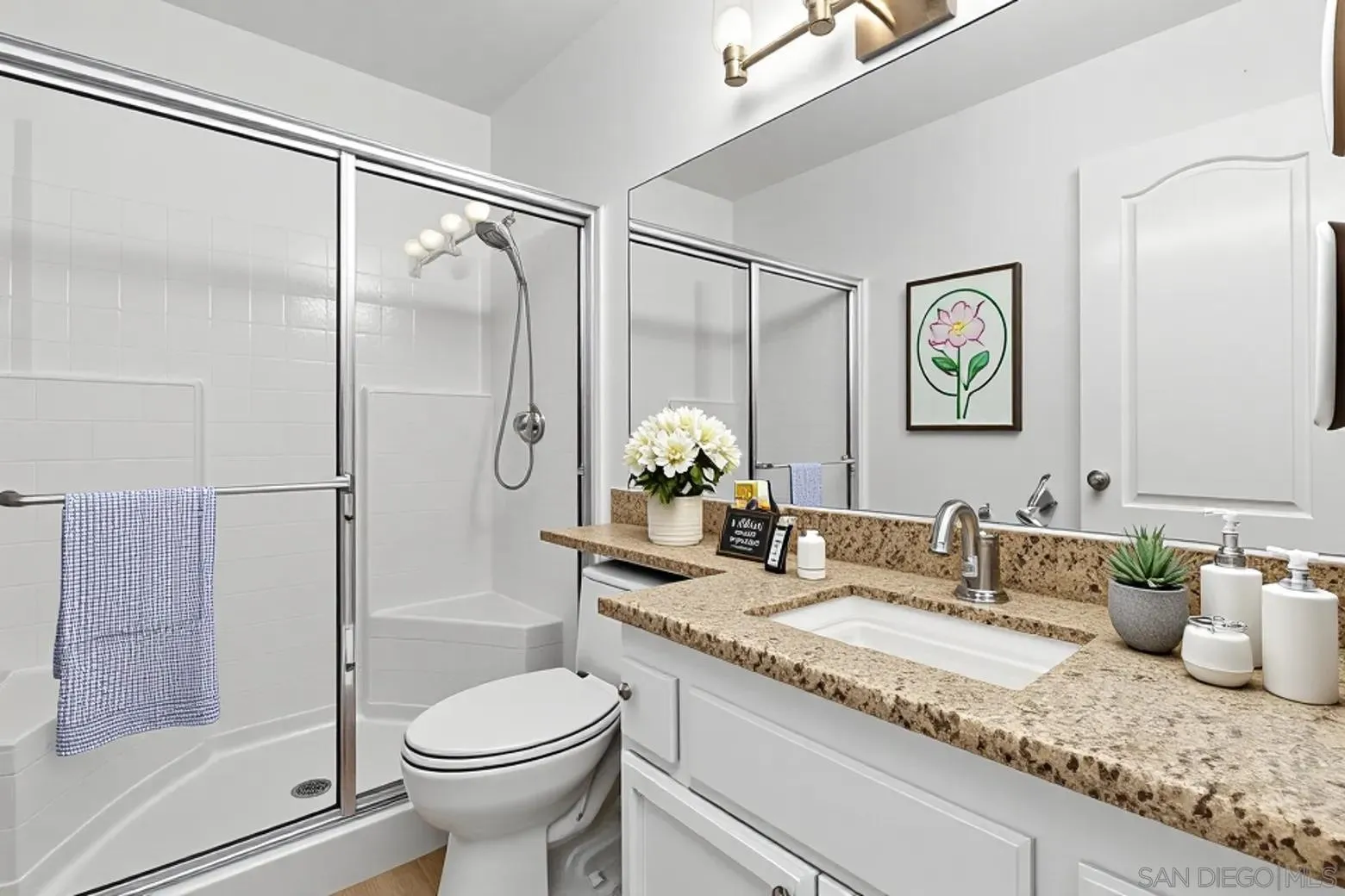 4802 Baroque Terrace Oceanside, CA 92057 - Photo 24 of 51 a bathroom with a granite countertop sink toilet and shower