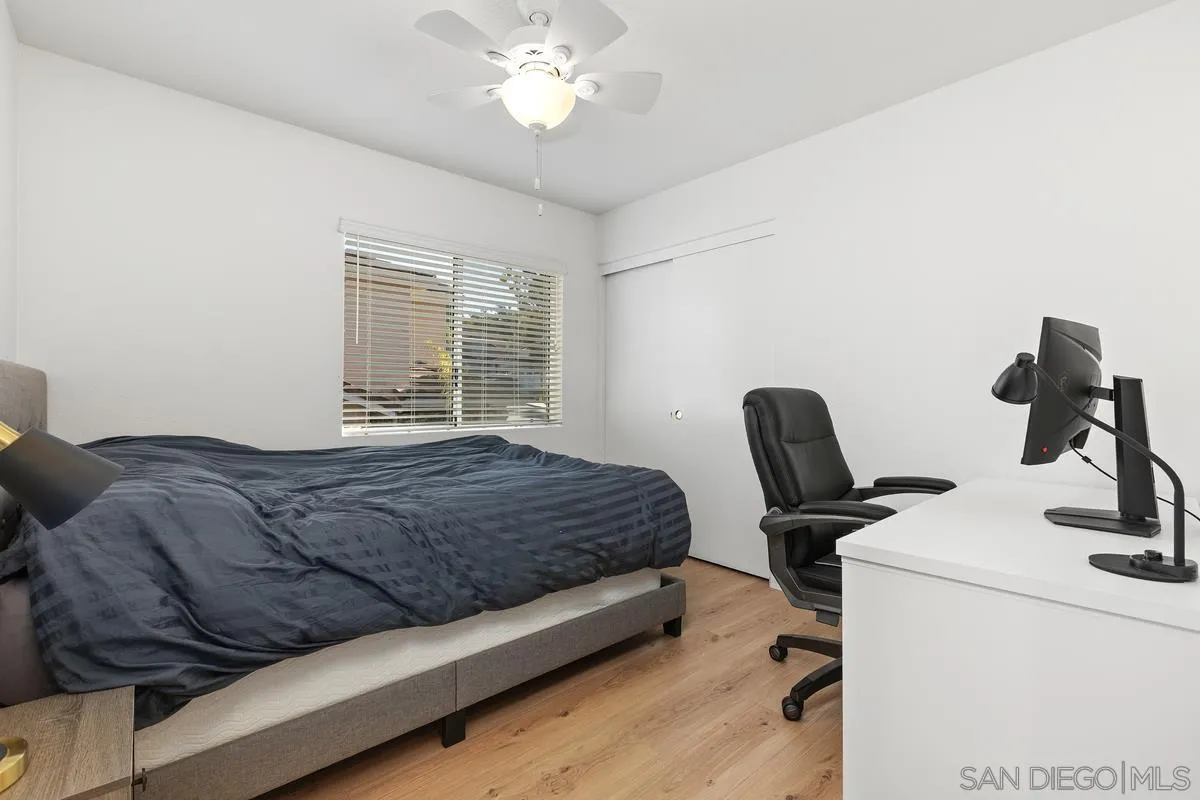 4802 Baroque Terrace Oceanside, CA 92057 - Photo 41 of 51 a bedroom with a bed and a chair
