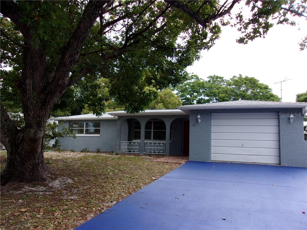 11608 Alpine Parkway Port Richey, FL 34668 - Photo 1 of 1 front view of house with a yard
