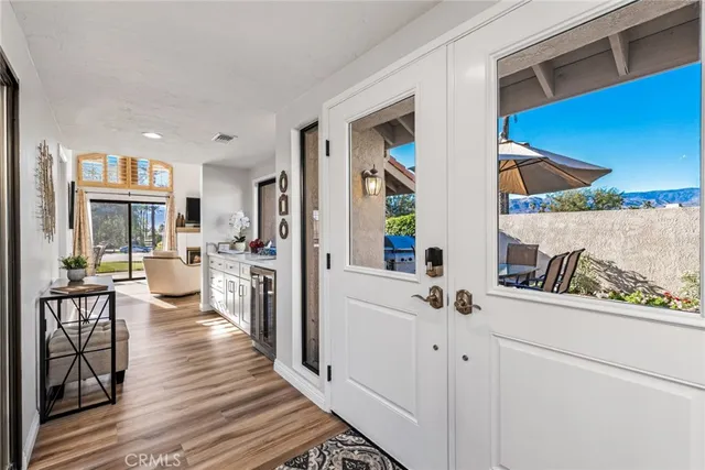a view of a living room and a wooden floor