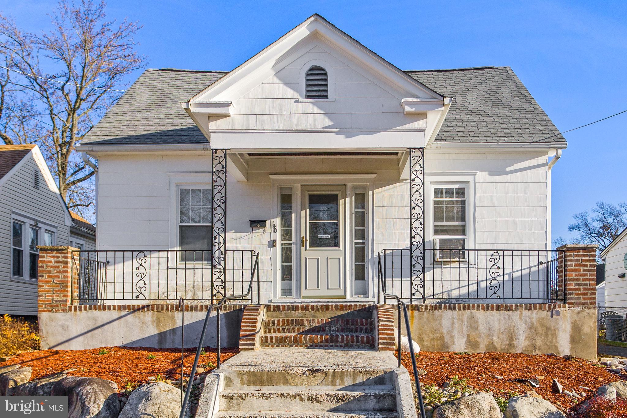 a view of a house with wooden deck