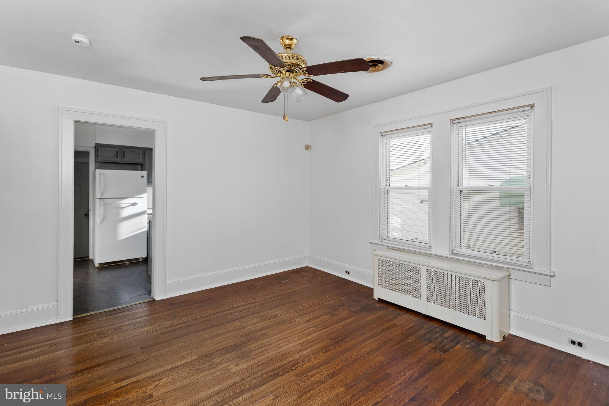 140 Maddock Avenue Hamilton, NJ 08610 - Photo 11 of 29 wooden floor in an empty room with a window