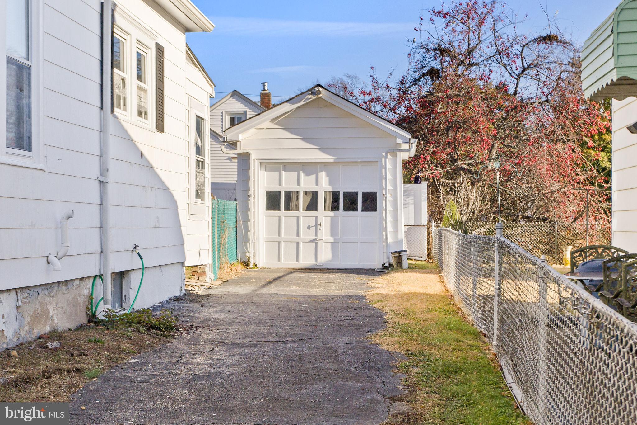140 Maddock Avenue Hamilton, NJ 08610 - Photo 29 of 29 a view of a white house with a large windows and a yard