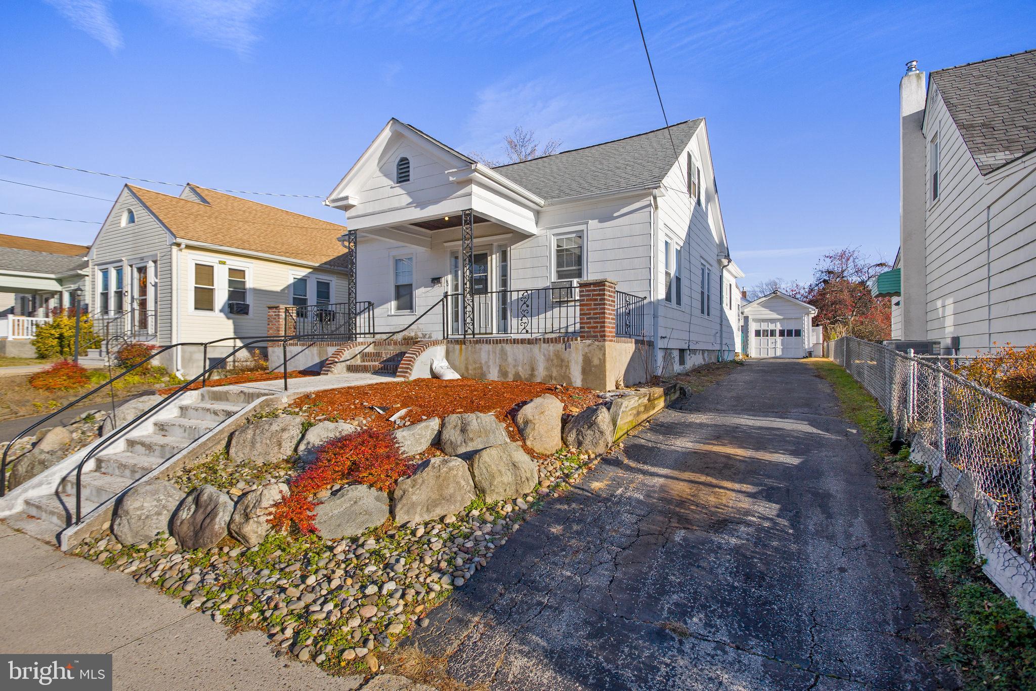 140 Maddock Avenue Hamilton, NJ 08610 - Photo 3 of 29 a view of a white house with a yard