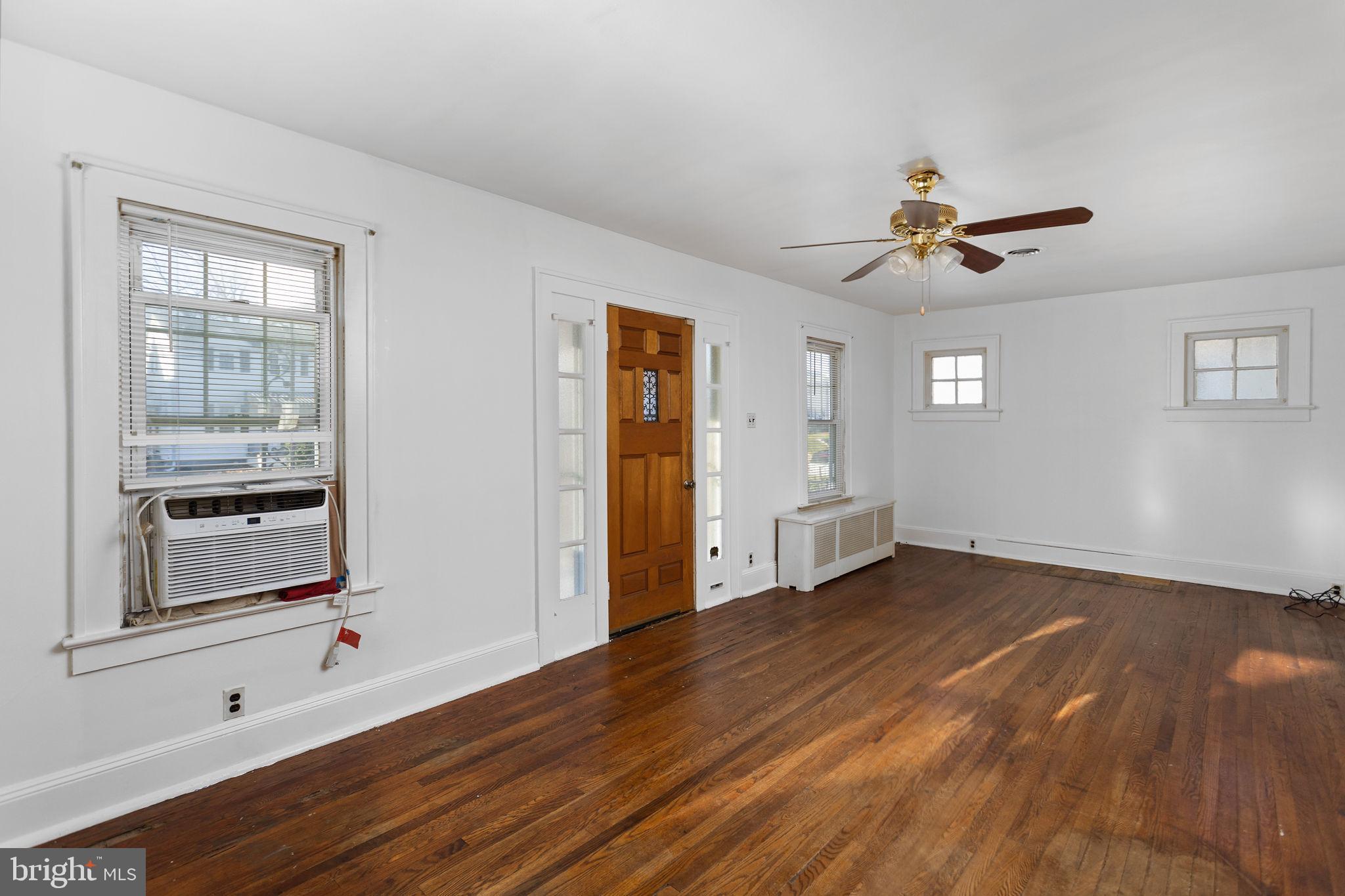140 Maddock Avenue Hamilton, NJ 08610 - Photo 7 of 29 a view of an empty room with a window and wooden floor