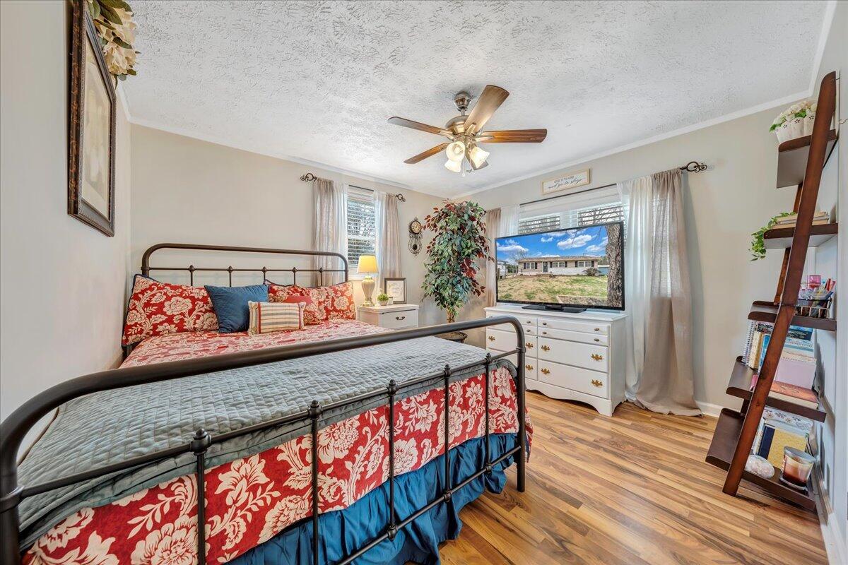 2152 Egg Farm Road Patrick Springs, VA 24133 - Photo 16 of 32 a bedroom with furniture and a flat screen tv