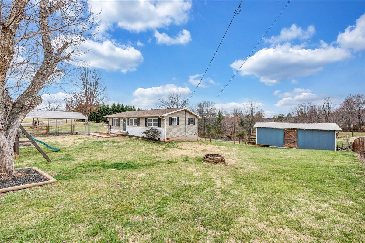 2152 Egg Farm Road Patrick Springs, VA 24133 - Photo 23 of 32 a view of house with yard and entertaining space