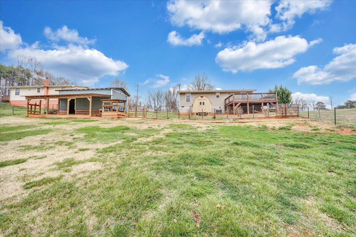 2152 Egg Farm Road Patrick Springs, VA 24133 - Photo 27 of 32 a view of a house with a big yard and large trees
