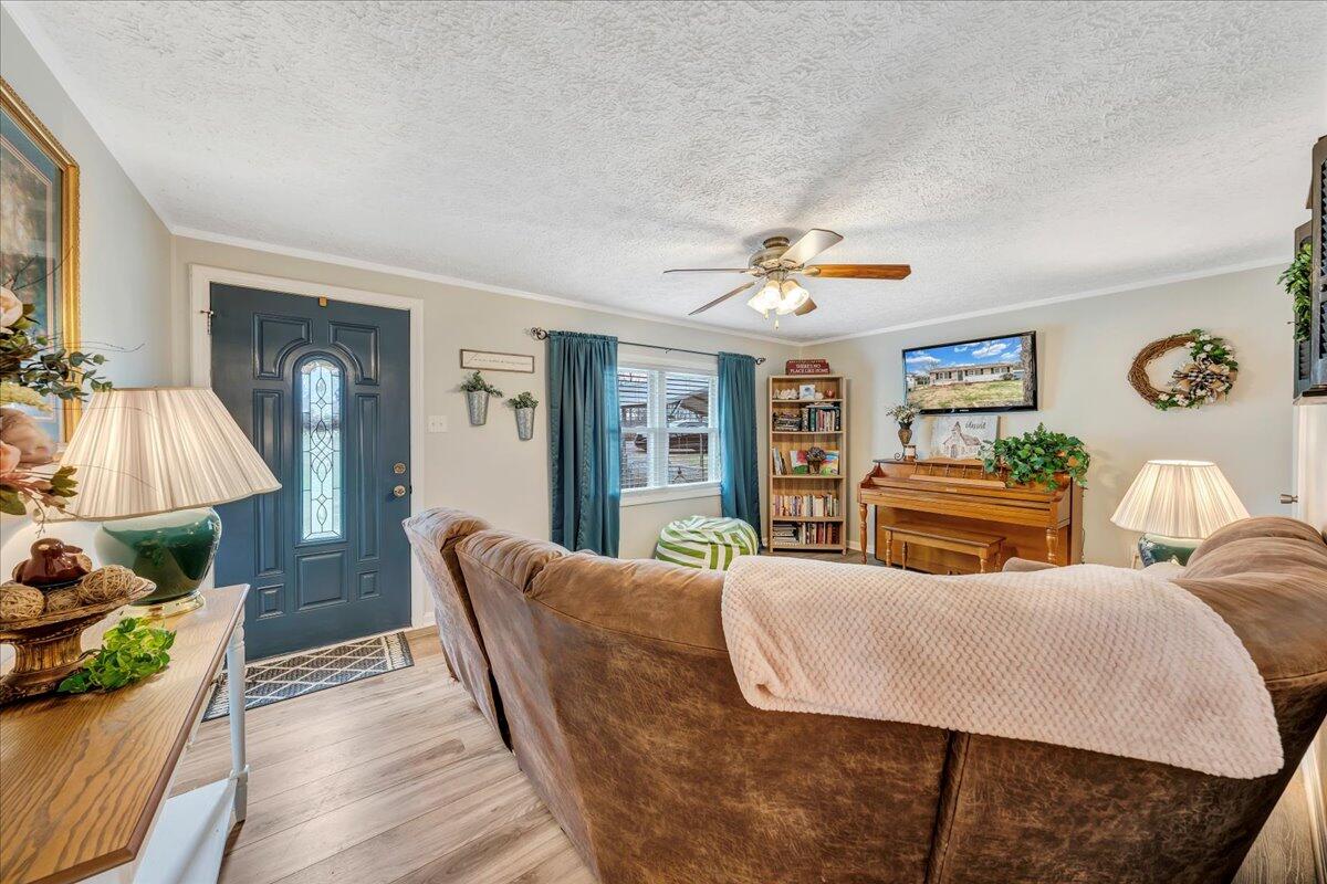 2152 Egg Farm Road Patrick Springs, VA 24133 - Photo 6 of 32 a living room with furniture and a flat screen tv
