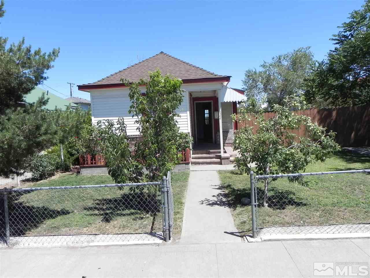 624 Quincy Street Reno, NV 89512 - Photo 1 of 17 a front view of a house with garden