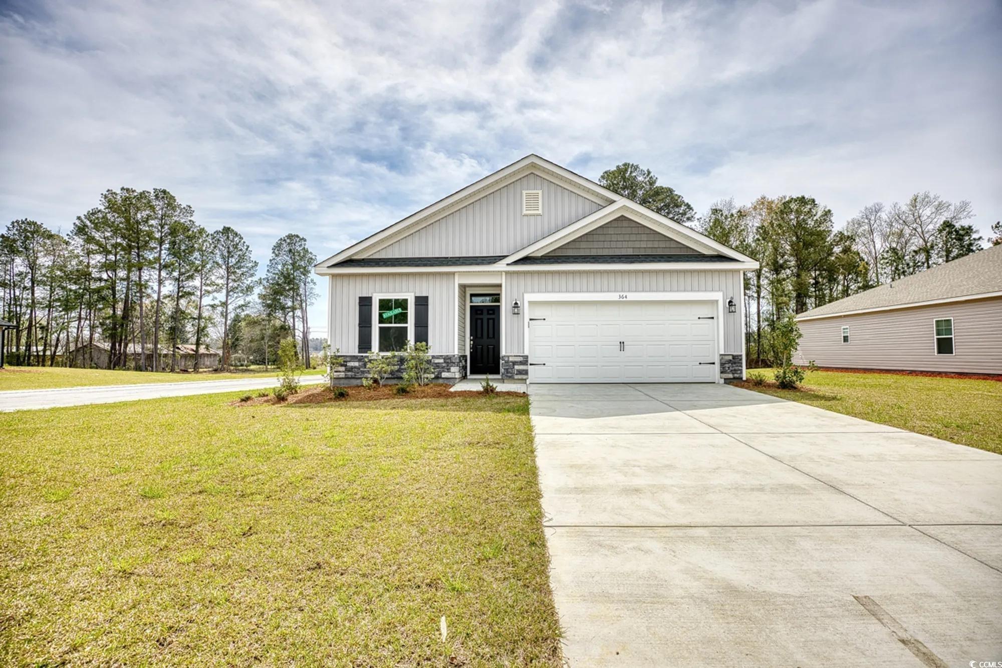 544 Honeyhill Loop Conway, SC 29526 - Photo 2 of 22 PHOTOS ARE OF SIMILIAR HOME PLAN, COLORS AND OPTIONS VARY FROM PICTURES SHOWN. View of front of house featuring concrete driveway, a front lawn, and an attached garage