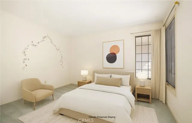 a bedroom with a bed and window