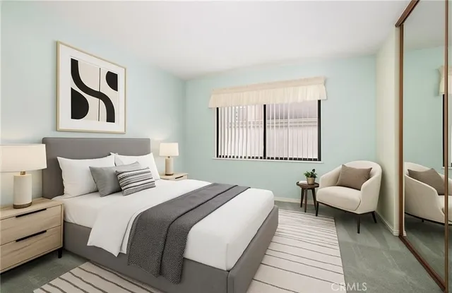 a bedroom with a bed and a couch