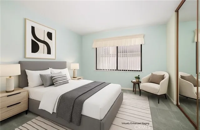 a bedroom with a bed and a couch